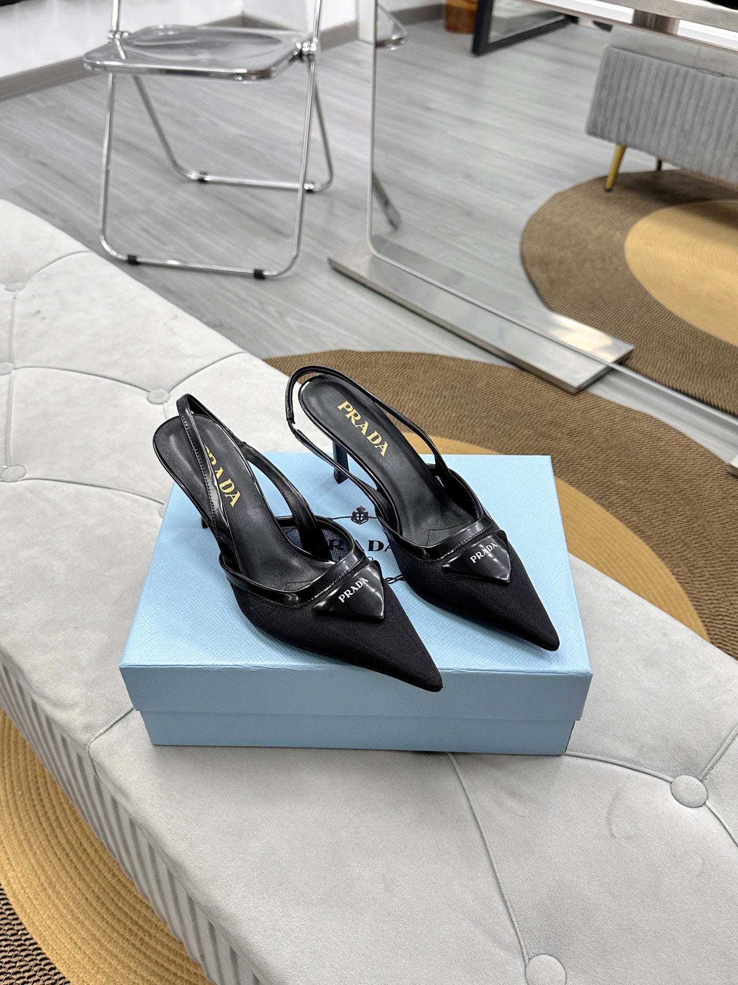PRADA 25S TRIANGLE LOGO SLINGBACK PUMPS IN BLACK MESH FABRIC