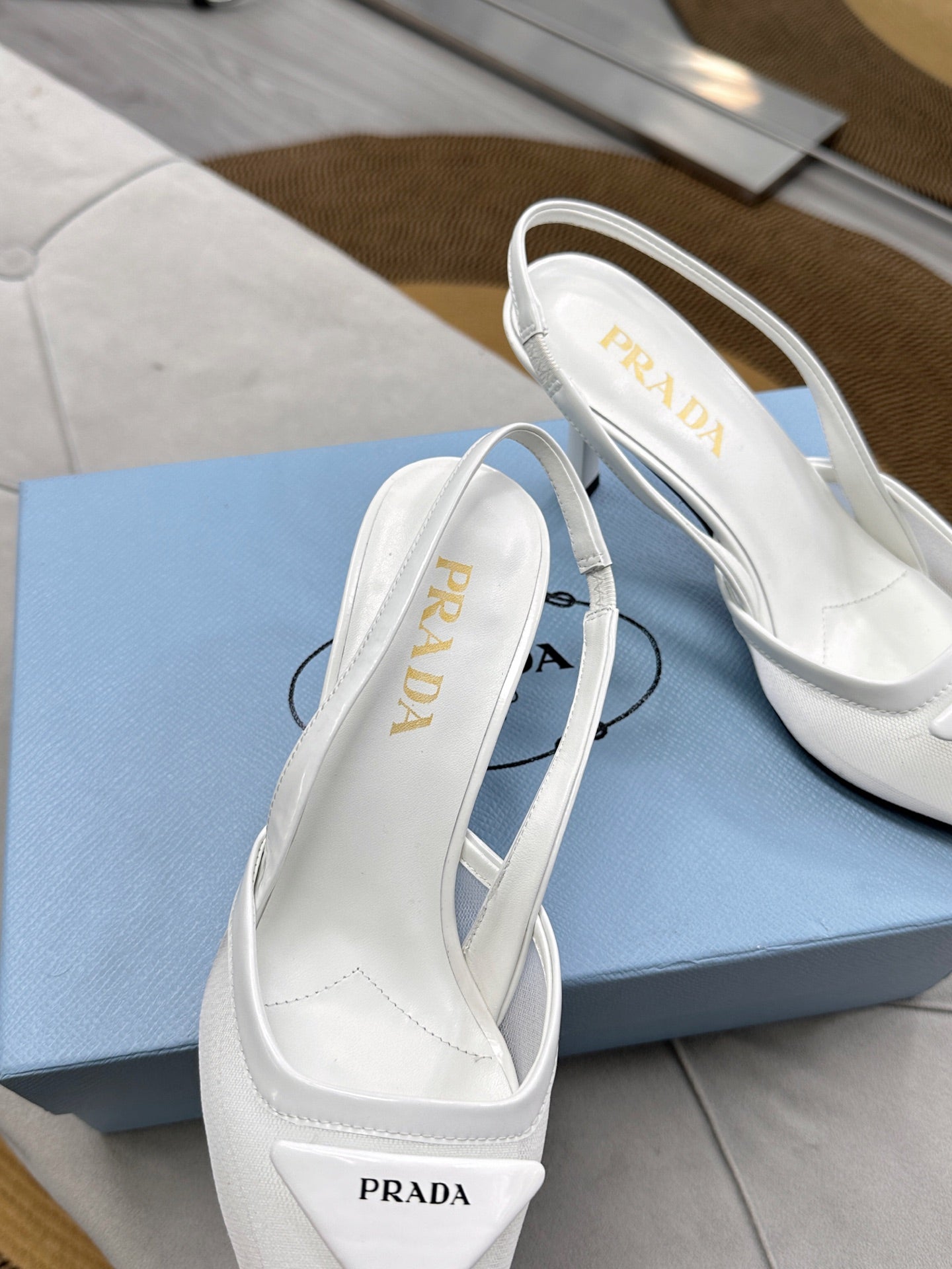 PRADA 25S TRIANGLE LOGO SLINGBACK PUMPS IN WHITE MESH FABRIC