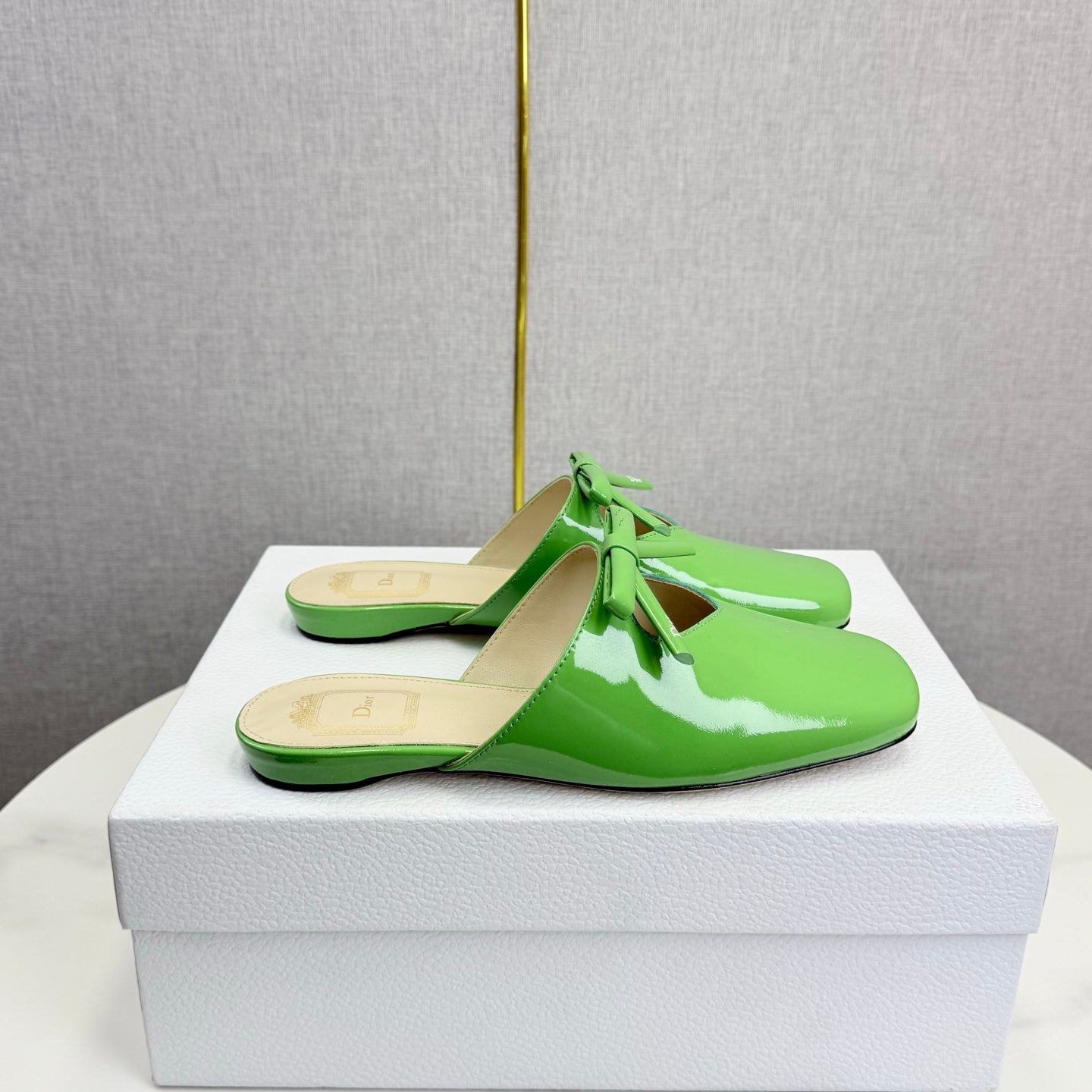 DIOR 26S PEARL-ACCENT BOW FLAT MULES IN FRESH GREEN GLOSSY CALFSKIN
