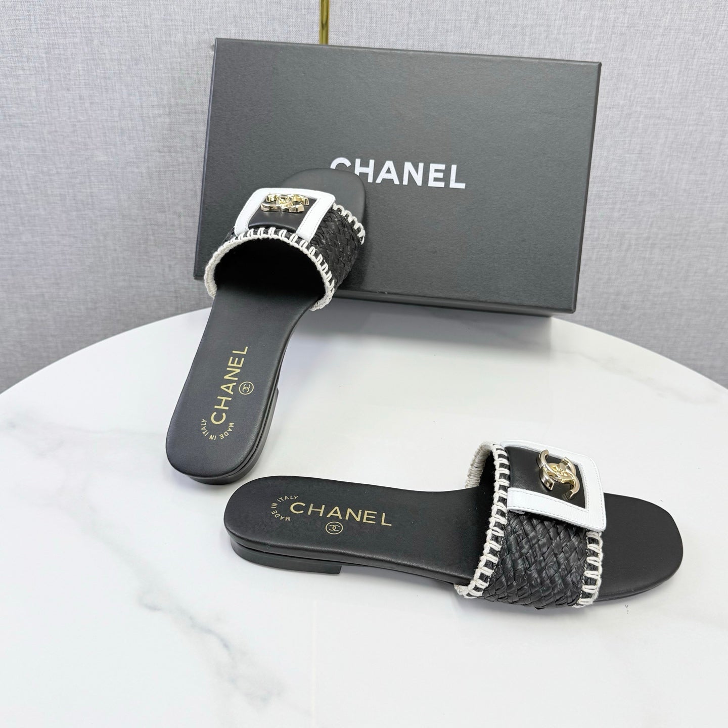 CHANEL 26S WOVEN STRAP SLIDES IN BLACK LAMBSKIN