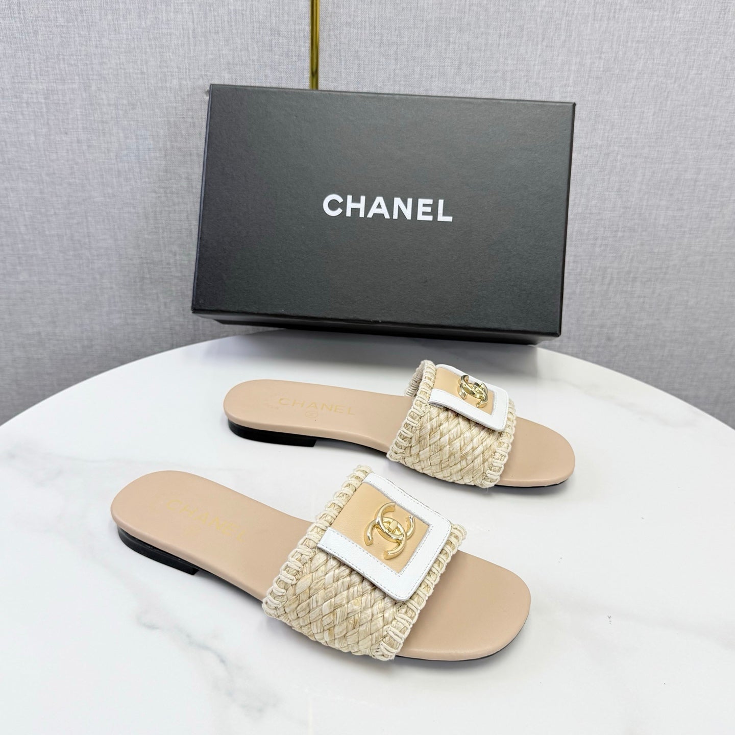 CHANEL 26S WOVEN STRAP SLIDES IN BEIGE LAMBSKIN