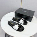CHANEL 26S ICONIC CC SLIDES IN WHITE LAMBSKIN