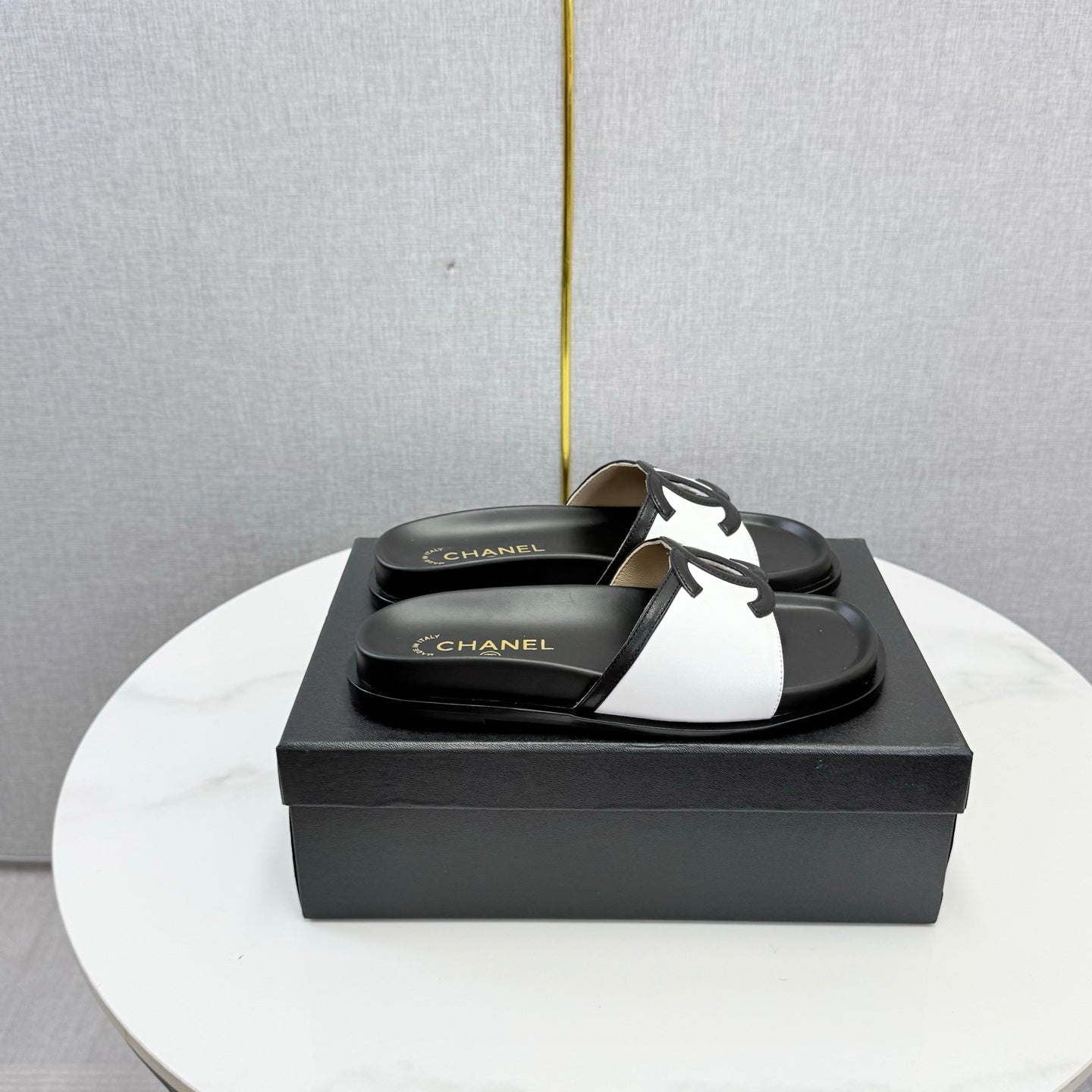 CHANEL 26S ICONIC CC SLIDES IN WHITE LAMBSKIN