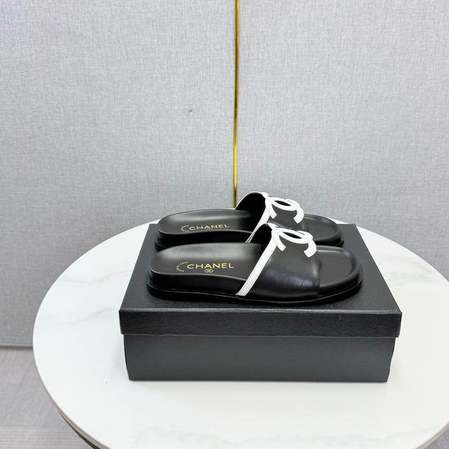 CHANEL 26S ICONIC CC SLIDES IN BLACK LAMBSKIN