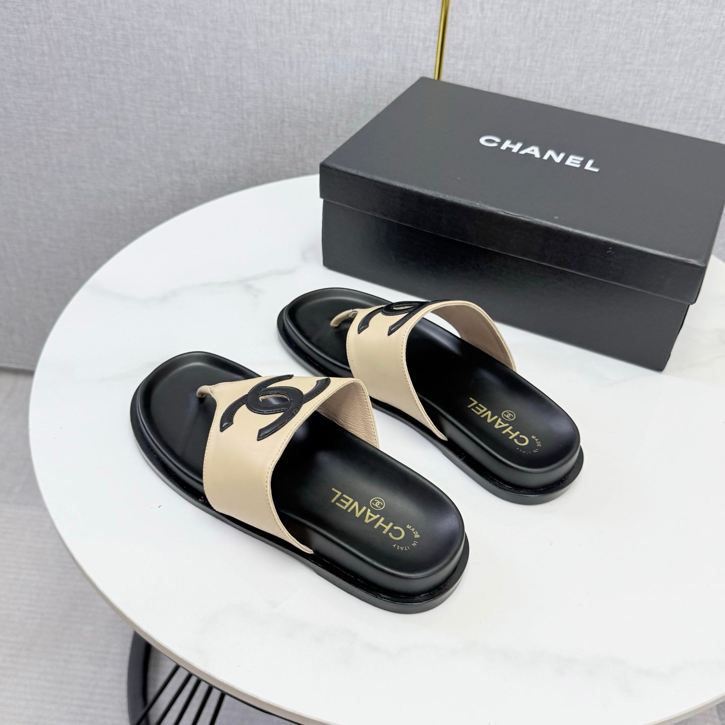 CHANEL 26S CC THONG SLIDES IN BEIGE AND BLACK LAMBSKIN