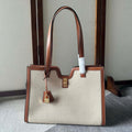 CABAS 37 IN WHITE CANVAS AND BRONZE BROWN CALFSKIN TRIM GOLD LOCK
