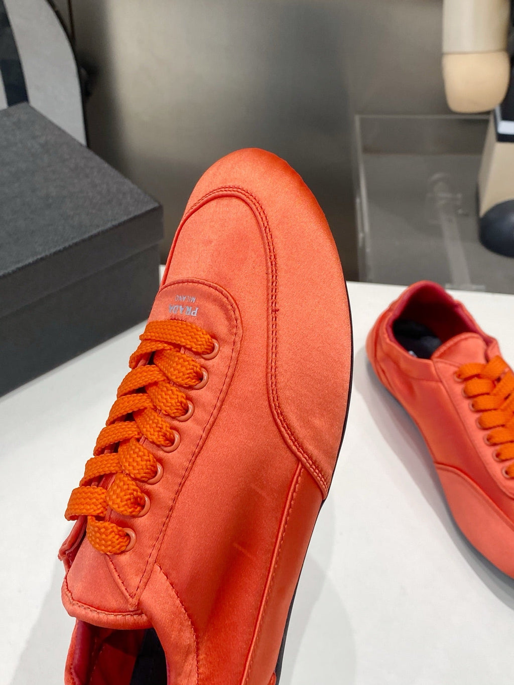 PRADA 26S SNEAKERS IN BURNT ORANGE SATIN