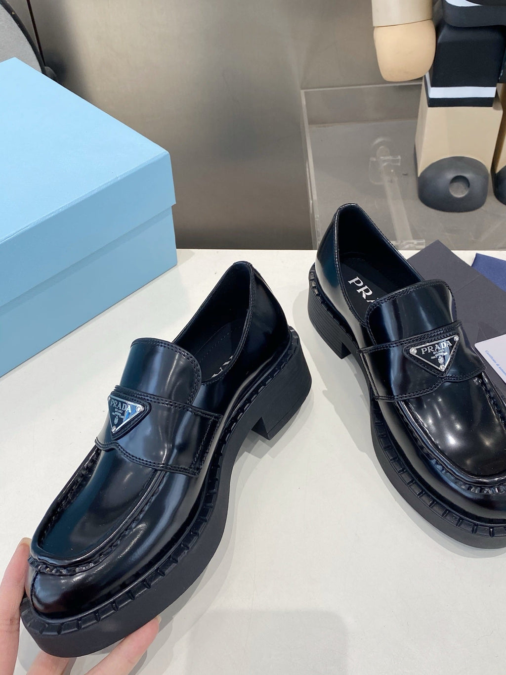 PRADA 26S LOAFERS IN BLACK CALFSKIN WITH LOGO SILVER HARDWARE