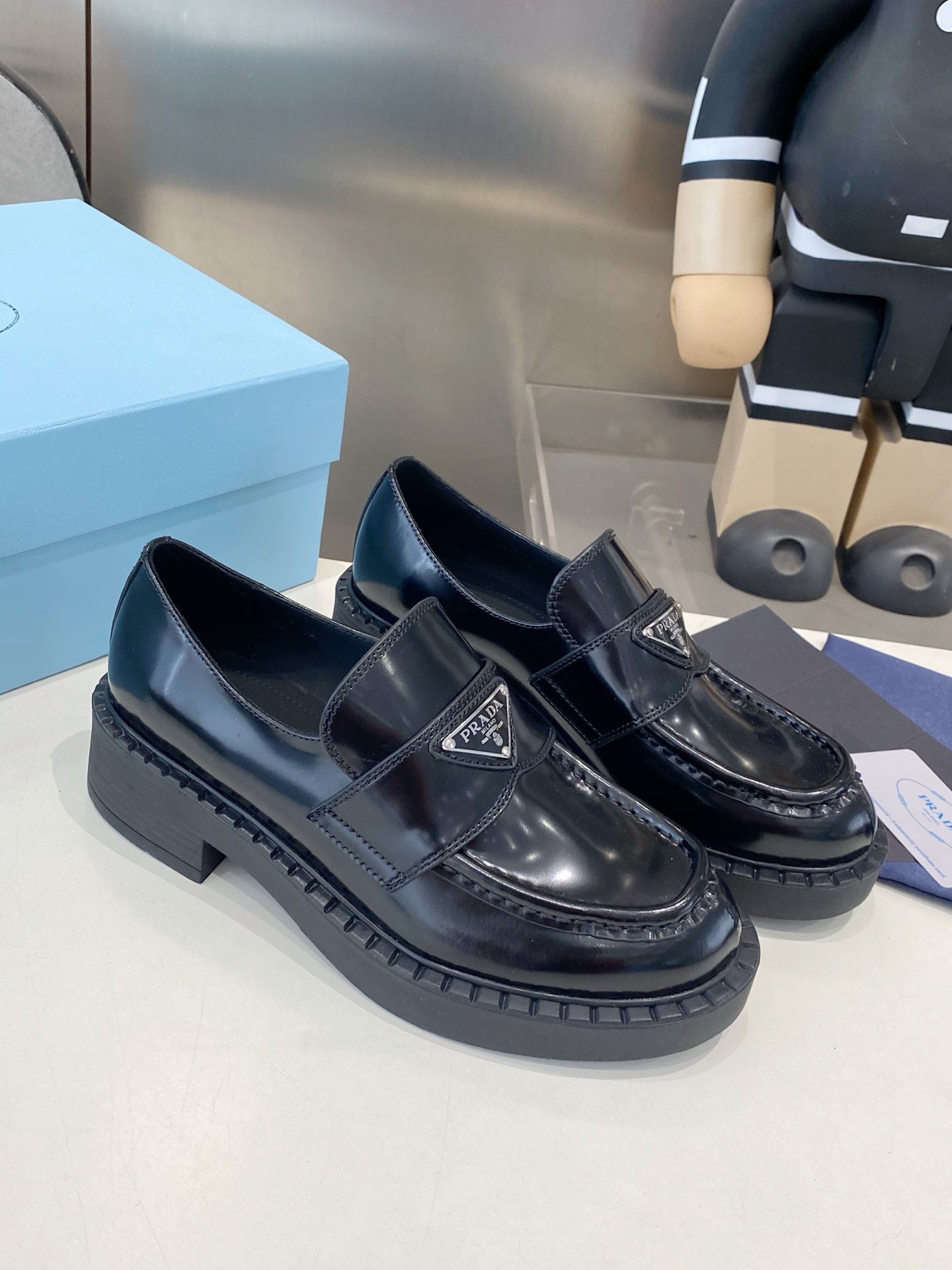 PRADA 26S LOAFERS IN BLACK CALFSKIN WITH LOGO SILVER HARDWARE