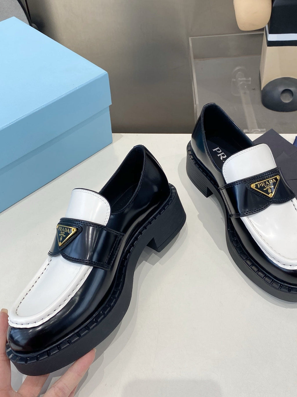 PRADA 26S LOAFERS IN BLACK AND WHITE CALFSKIN WITH LOGO