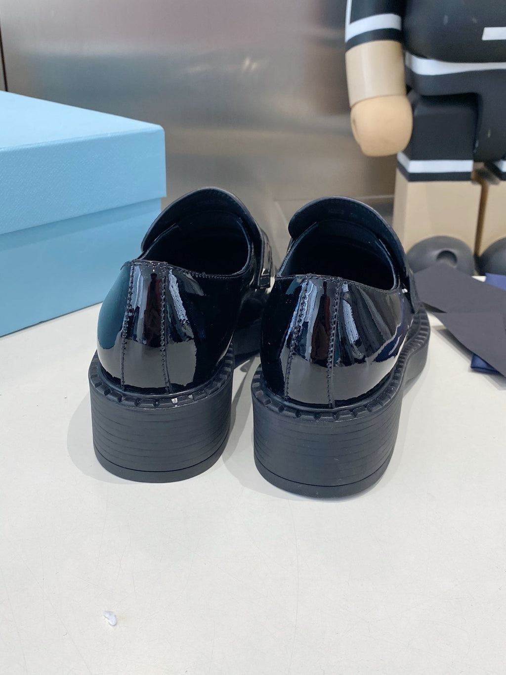 PRADA 26S LOAFERS IN BLACK PATENT CALFSKIN WITH LOGO