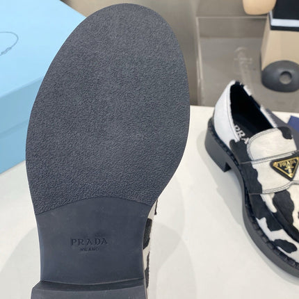 PRADA 26S LOAFERS IN WHITE AND BLACK COW PRINT PONY HAIR