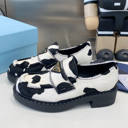 PRADA 26S LOAFERS IN WHITE AND BLACK COW PRINT PONY HAIR