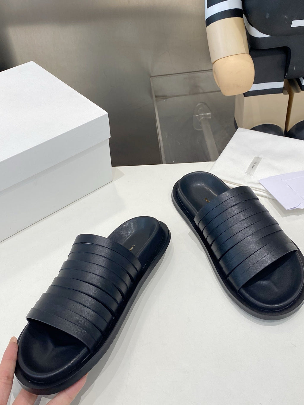 THE ROW 26S MULTI STRAP SLIDES IN BLACK CALFSKIN