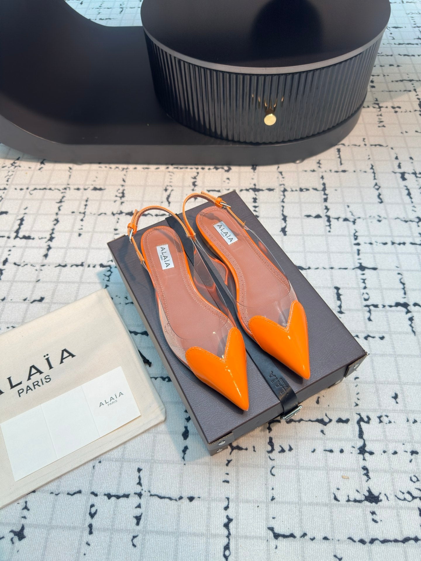 ALAIA FLAT SLINGBACK IN TIGER ORANGE PATENT CALFSKIN AND FILM
