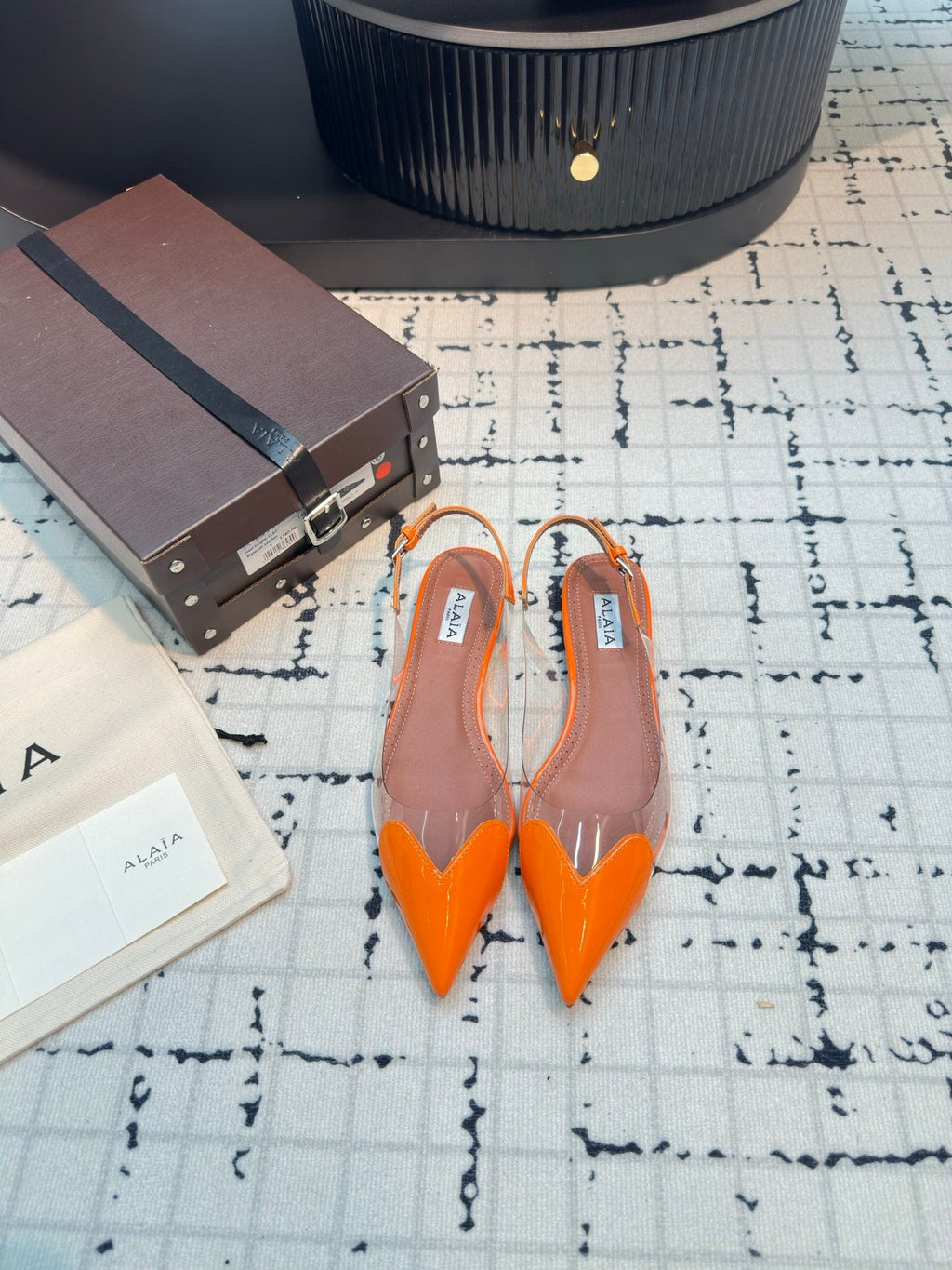 ALAIA FLAT SLINGBACK IN TIGER ORANGE PATENT CALFSKIN AND FILM