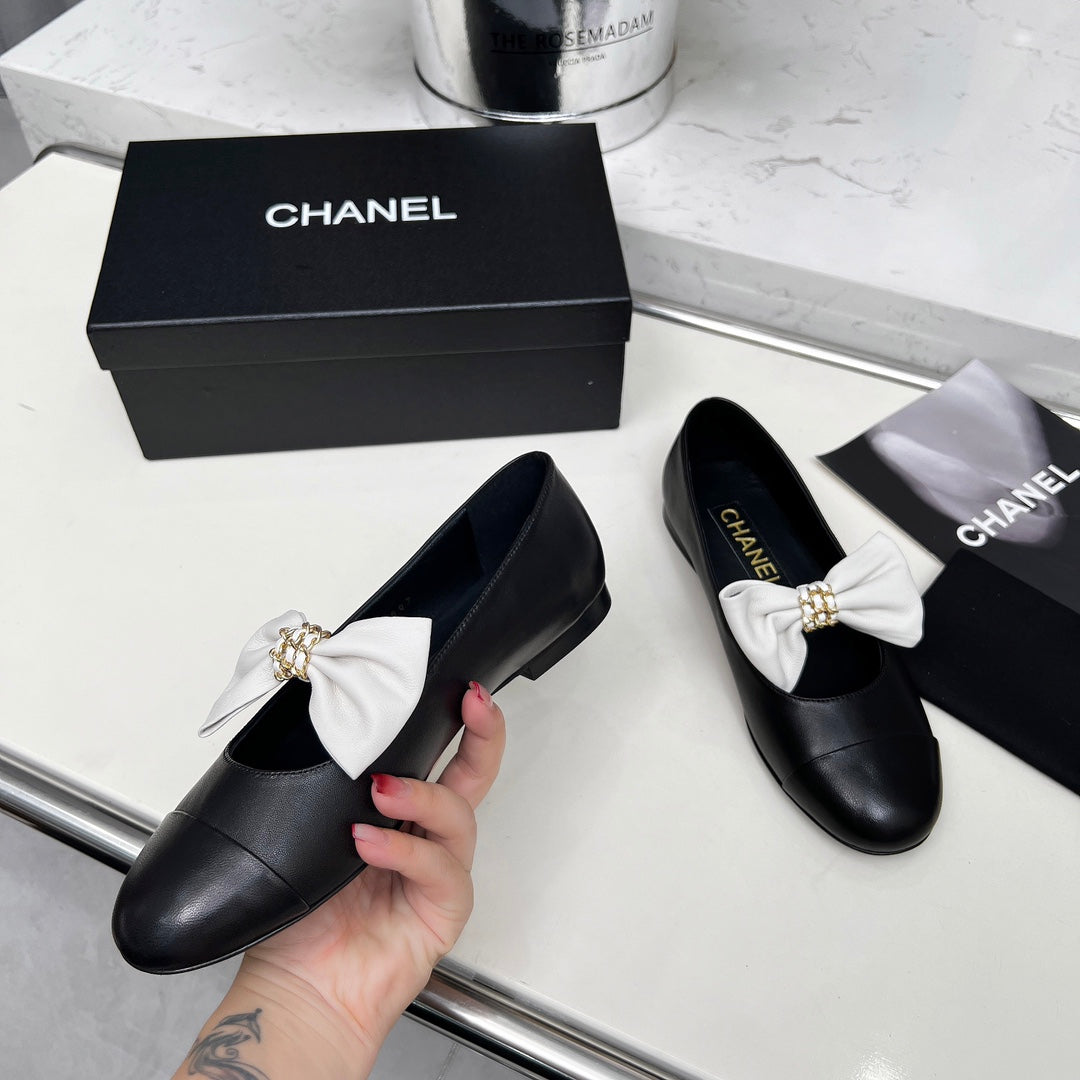 CHANEL 25S MARY JANES IN BLACK CALFSKIN WITH WHITE BOW GOLD HARDWARE
