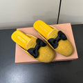 BOW MULES IN DUST YELLOW SUEDE