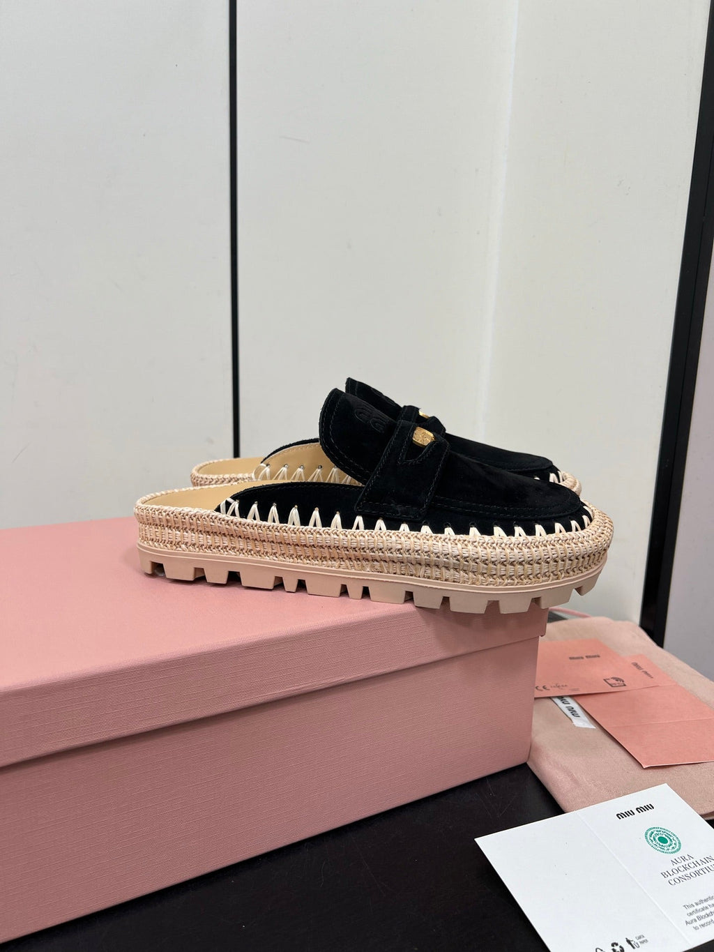 MULES SLIPPERS IN BLACK SUEDE WITH GOLD COIN