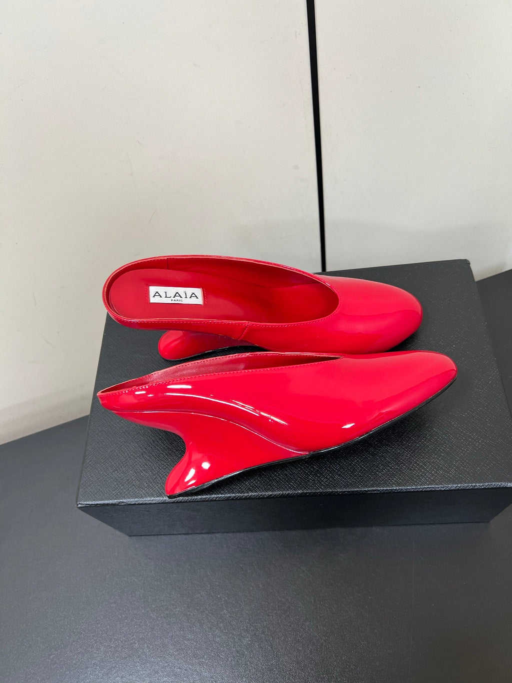 ALAIA WEDGE MULES 25S IN RED LAMBSKIN