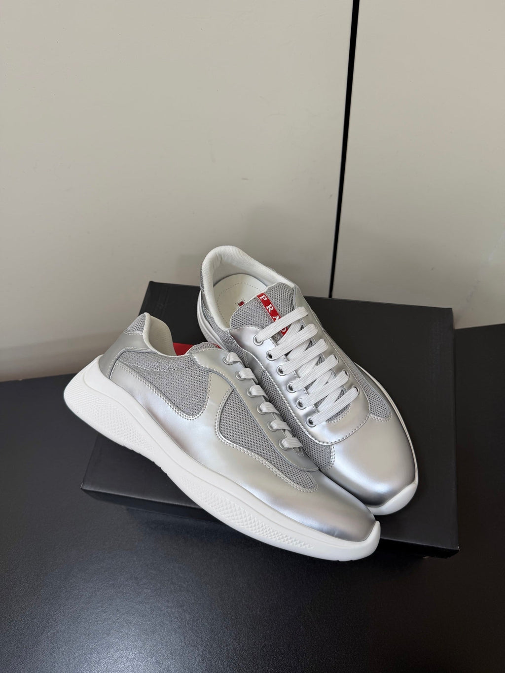 PRADA 26S SNEAKERS IN SILVER CALFSKIN AND WHITE MESH