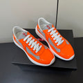 PRADA 26S SNEAKERS IN ORANGE PATENT CALFSKIN AND WHITE MESH