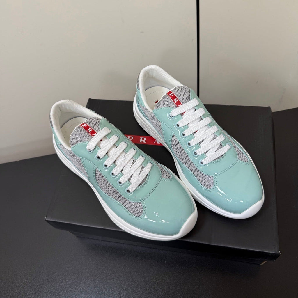 PRADA 26S SNEAKERS IN SOFT TEAL PATENT CALFSKIN AND WHITE MESH