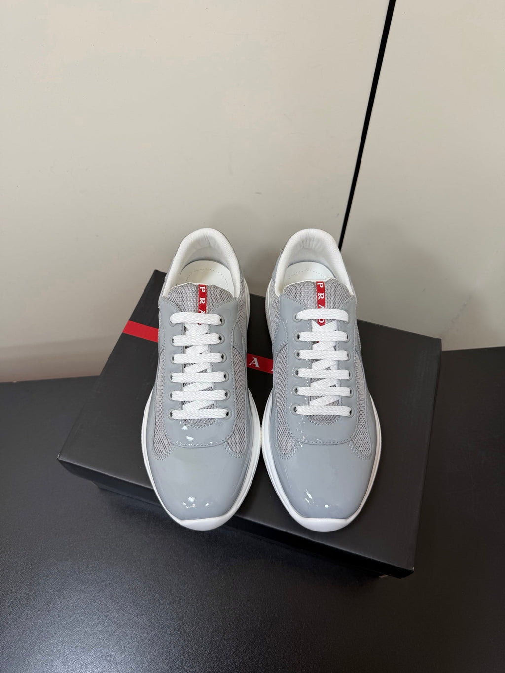 PRADA 26S SNEAKERS IN LIGHT GRAY PATENT CALFSKIN AND WHITE MESH