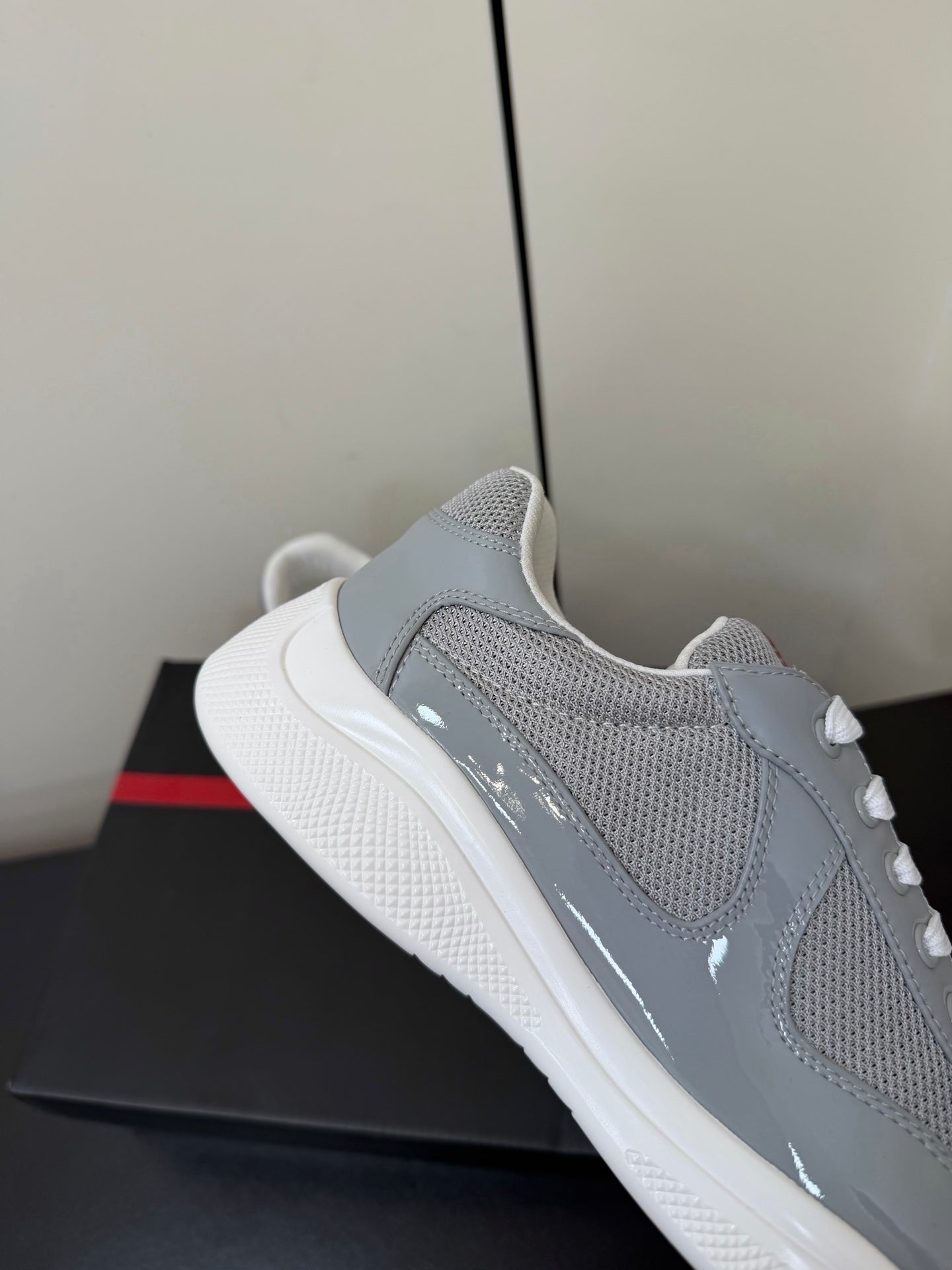 PRADA 26S SNEAKERS IN LIGHT GRAY PATENT CALFSKIN AND WHITE MESH