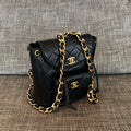 CHANEL 26S BACKPACK WITH FRONT POCKET 21 IN BLACK QUILTED LAMBSKIN GOLD HARDWARE