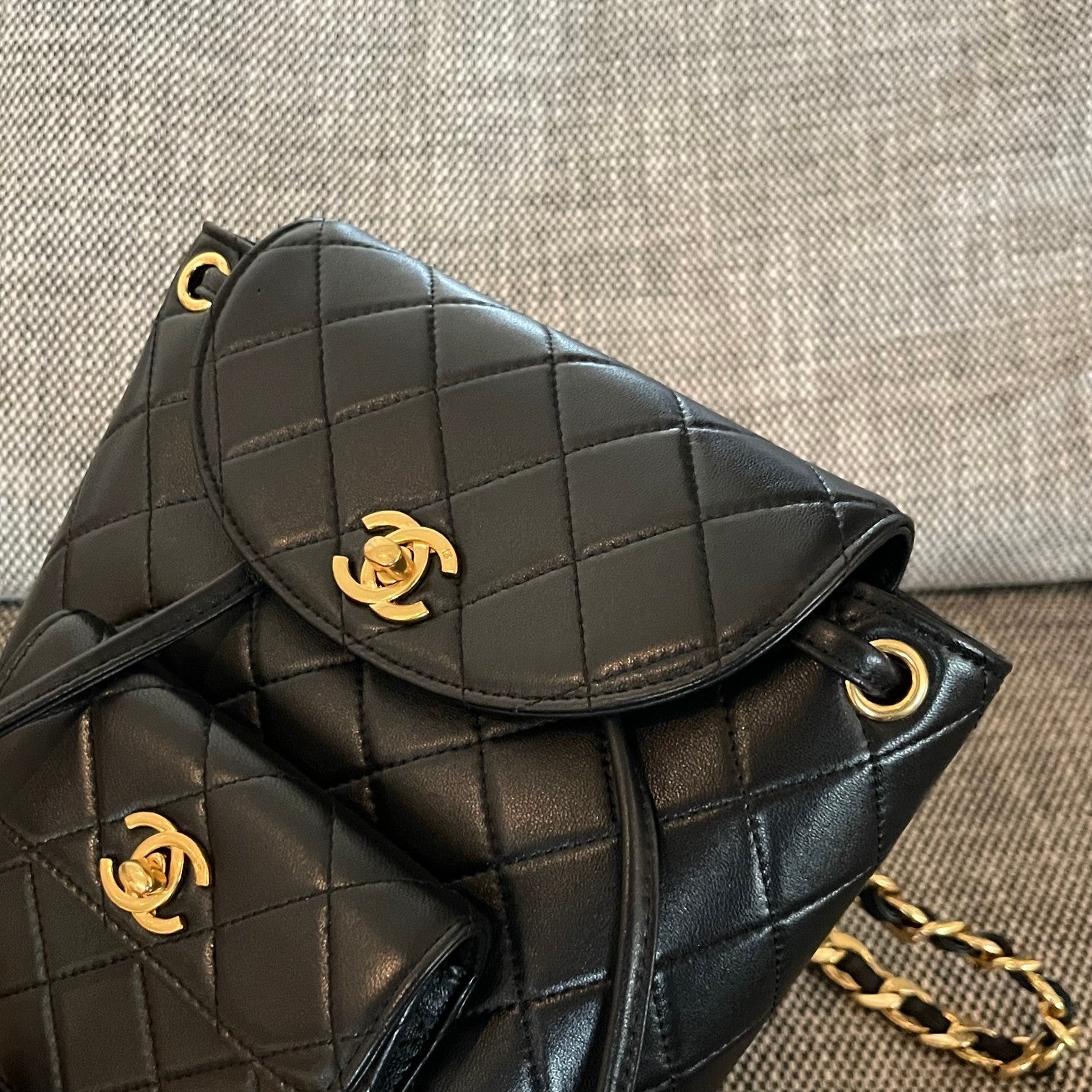CHANEL 26S BACKPACK WITH FRONT POCKET 21 IN BLACK QUILTED LAMBSKIN GOLD HARDWARE