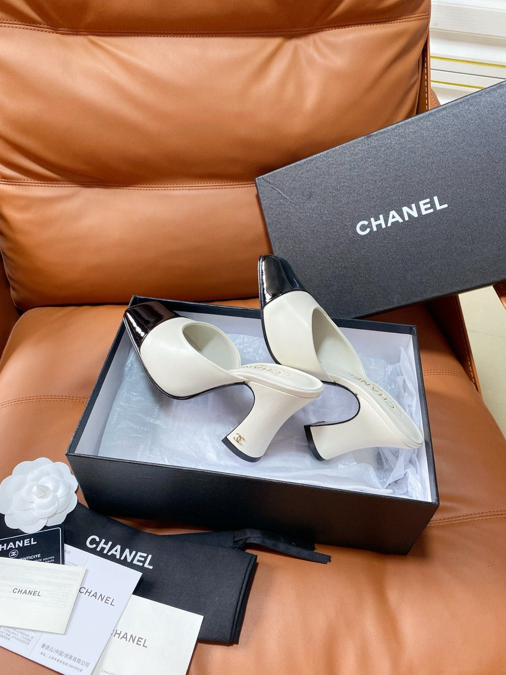 CHANEL 26S HIGH-HEEL MULES 90 MM IN BLACK AND WHITE LAMBSKIN