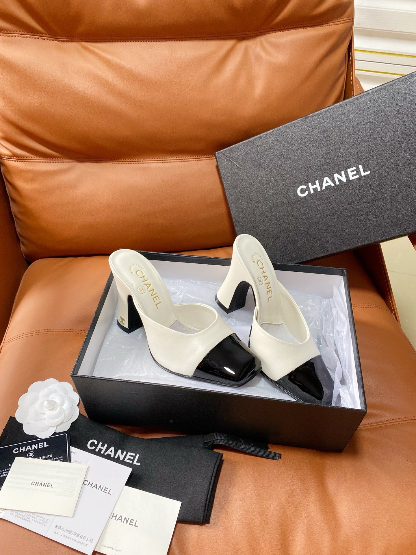 CHANEL 26S HIGH-HEEL MULES 90 MM IN BLACK AND WHITE LAMBSKIN