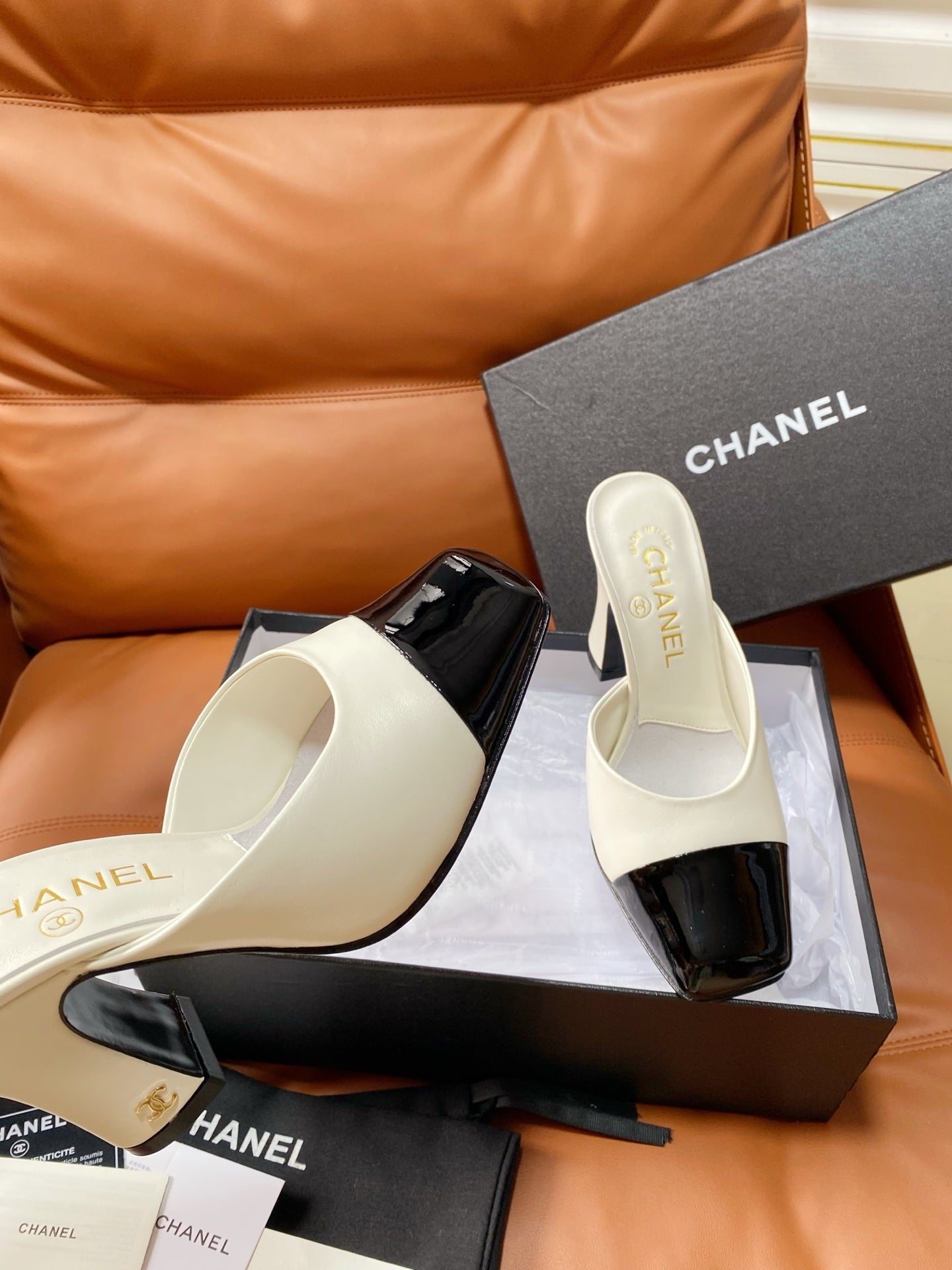 CHANEL 26S HIGH-HEEL MULES 90 MM IN BLACK AND WHITE LAMBSKIN