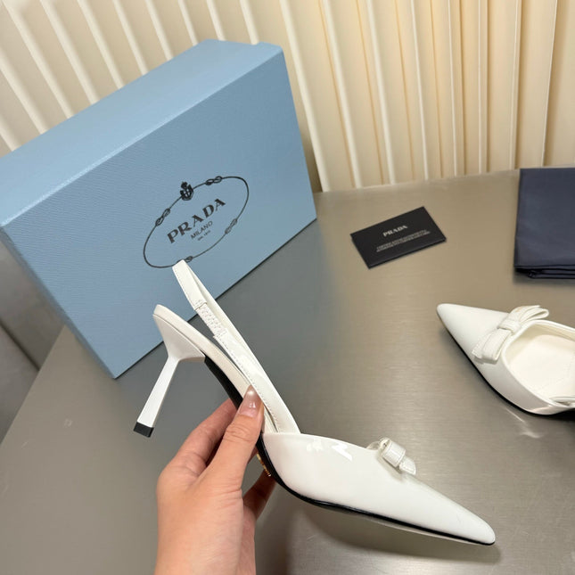 PRADA 26S POINTED-TOE SLINGBACK PUMPS IN WHITE PATENT CALFSKIN WITH BOW