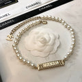 CHANEL 26S CHANEL LETTER CRYSTAL BAR PEARL NECKLACE IN GOLD METAL 631883
