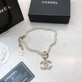 CHANEL 26S CHANEL CC LOGO PEARL BEADED NECKLACE WITH CHARM DETAIL IN GOLD METAL 633323