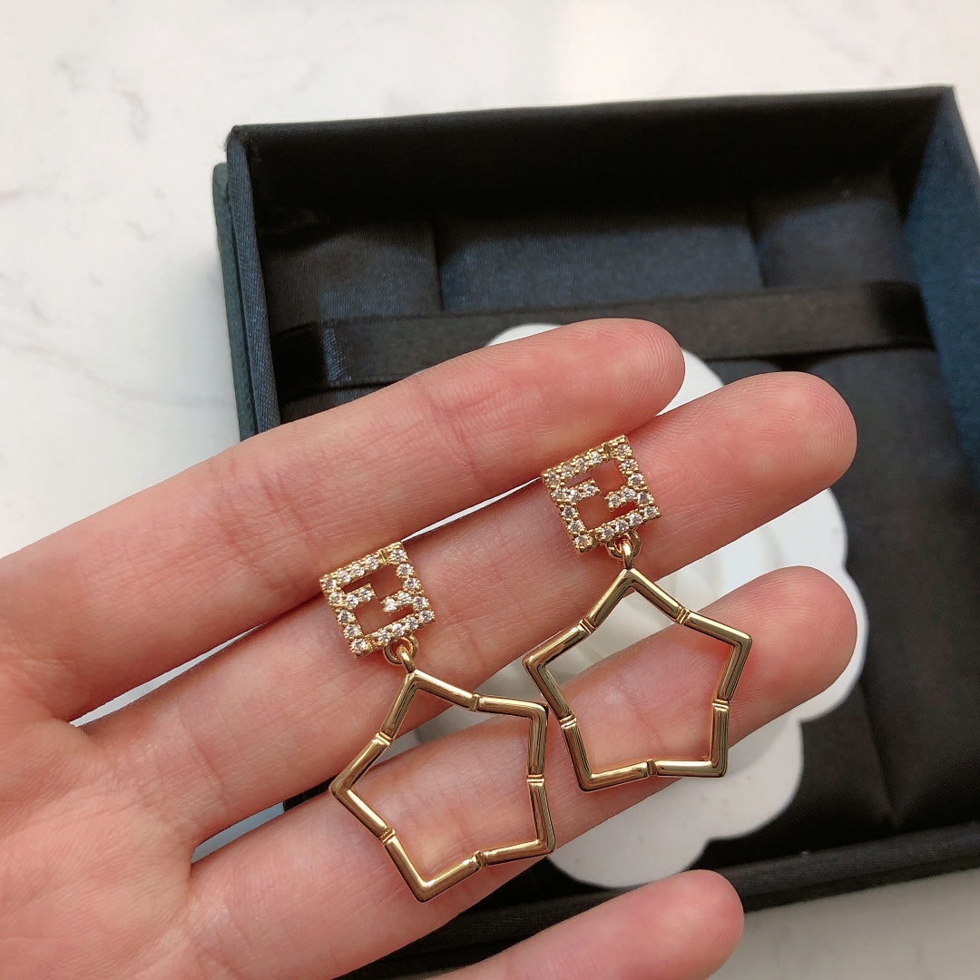 FENDI 26S FF CRYSTAL STAR DROP EARRINGS IN GOLD TONE METAL 622647