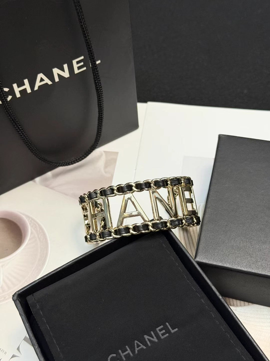 CHANEL 26S CHANEL LOGO OPEN CUFF LEATHER CHAIN BRACELET IN GOLD METAL 630836