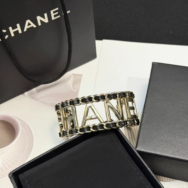 CHANEL 26S CHANEL LOGO OPEN CUFF LEATHER CHAIN BRACELET IN GOLD METAL 630836