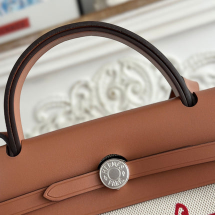 HERBAG ZIP 31 RETOURNE PEGASE POP BAG IN OFF-WHITE MIX RED CANVAS AND HUNTER COWHIDE
