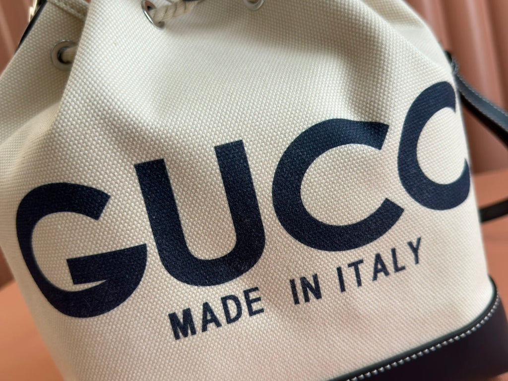 DRAWSTRING SHOULDER BAG LOGO PRINT 31 IN WHITE CANVAS DARK BLUE CALFSKIN