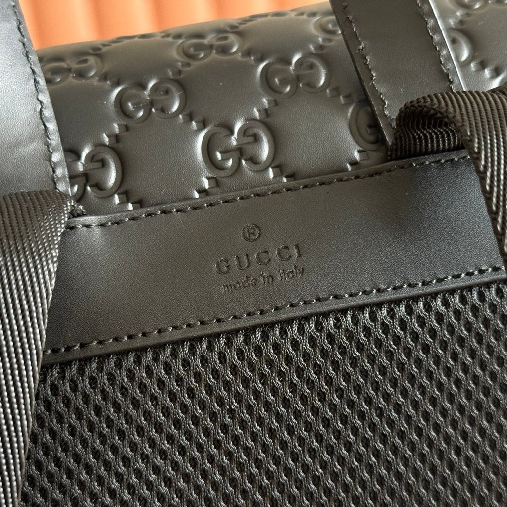 GUCCI 26S GG EMBLEM BACKPACK 44 IN BLACK EMBOSSED CALFSKIN