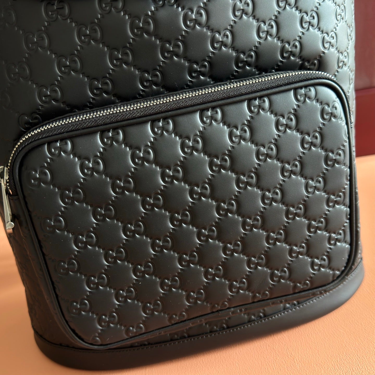 GUCCI 26S GG EMBLEM BACKPACK 44 IN BLACK EMBOSSED CALFSKIN