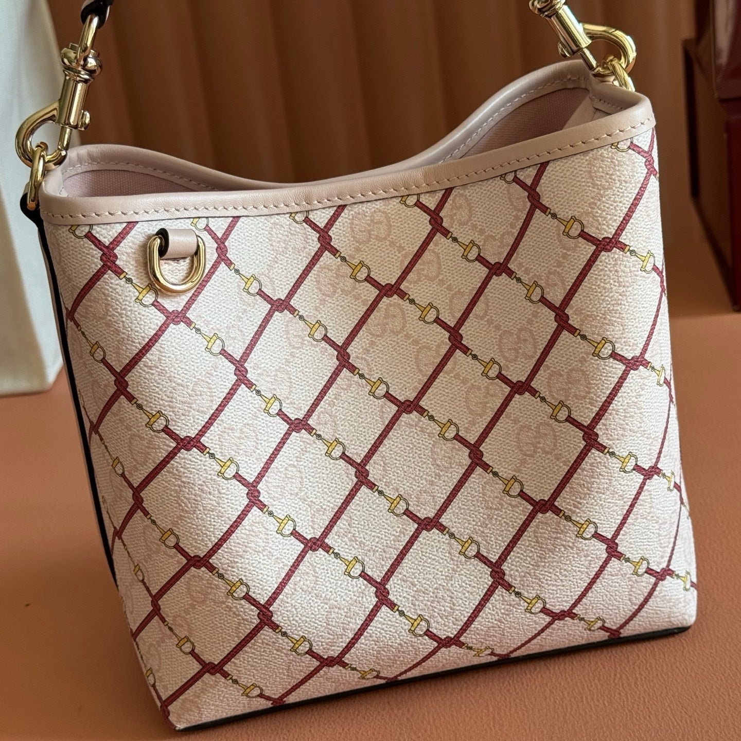 GUCCI 26S GG EMBLEM BUCKET BAG 19 IN LIGHT PINK COATED FABRIC