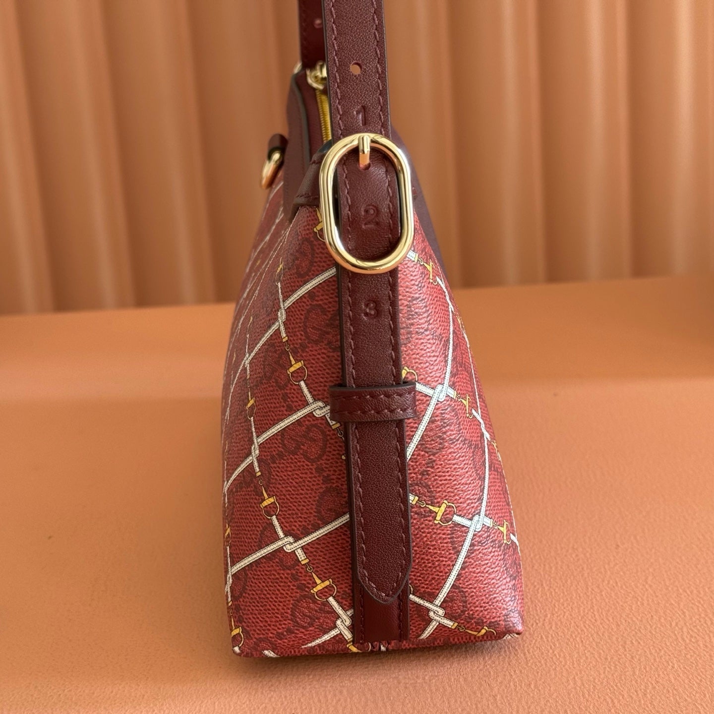 GUCCI 26S GG EMBLEM BUCKET BAG 22 IN DARK RED COATED FABRIC