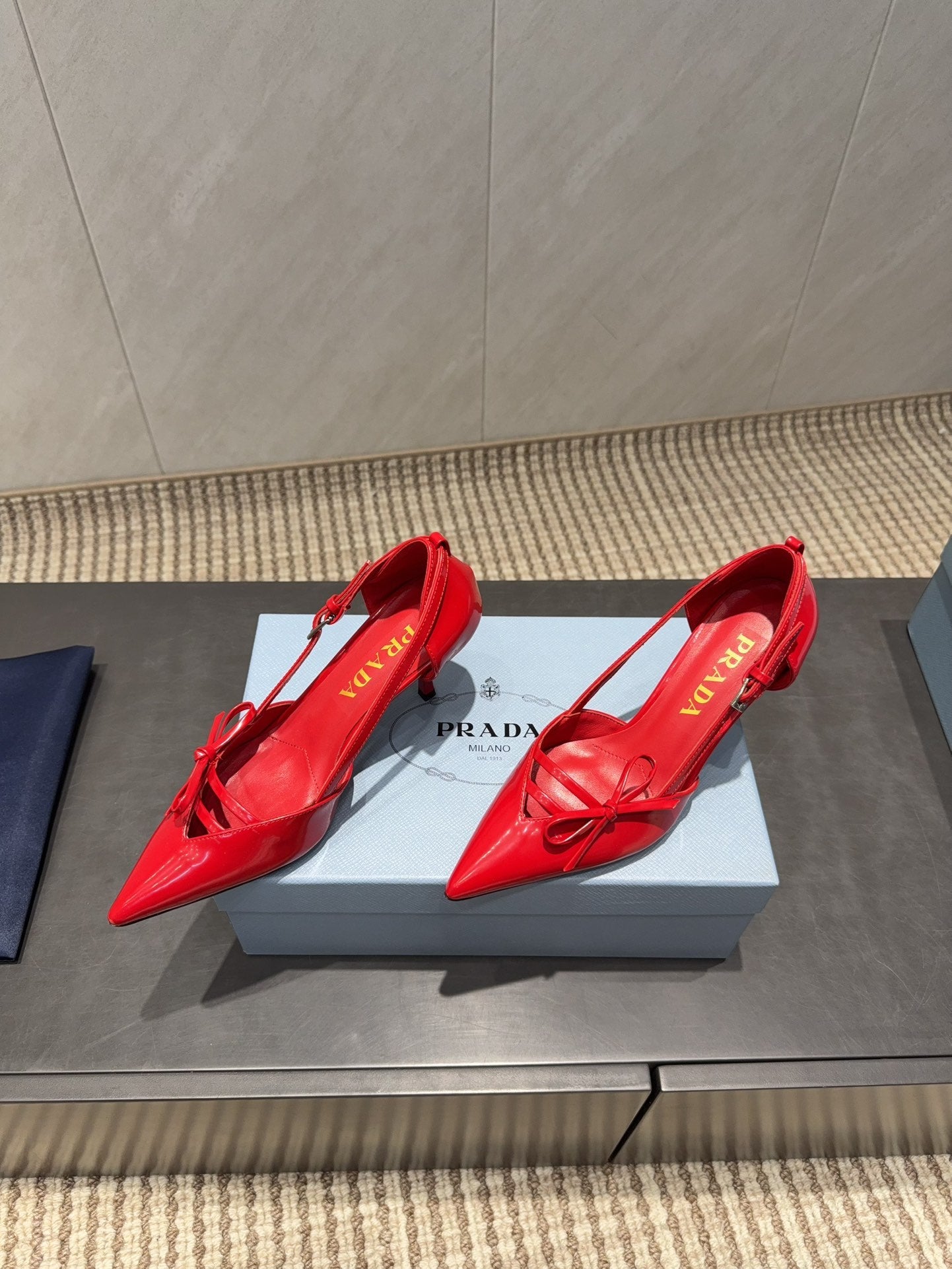 PRADA 26S POINTED TOE CUT OUT HIGH HEELS 75MM IN BRIGHT RED CALFSKIN WITH BOW