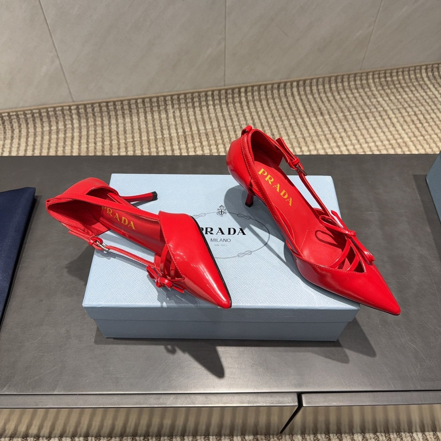 PRADA 26S POINTED TOE CUT OUT HIGH HEELS 75MM IN BRIGHT RED CALFSKIN WITH BOW