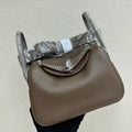 HM 25S MINI LINDY 19 CM IN TAUPE COWHIDE WITH CROCODILE HANDLE AND SILVER HARDWARE