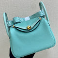 HM 25S MINI LINDY 19 CM IN AQUAMARINE COWHIDE WITH CROCODILE HANDLE AND GOLD HARDWARE